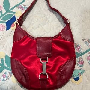 Beautiful red satin and leather purse. Great interior, rhinestone closure.